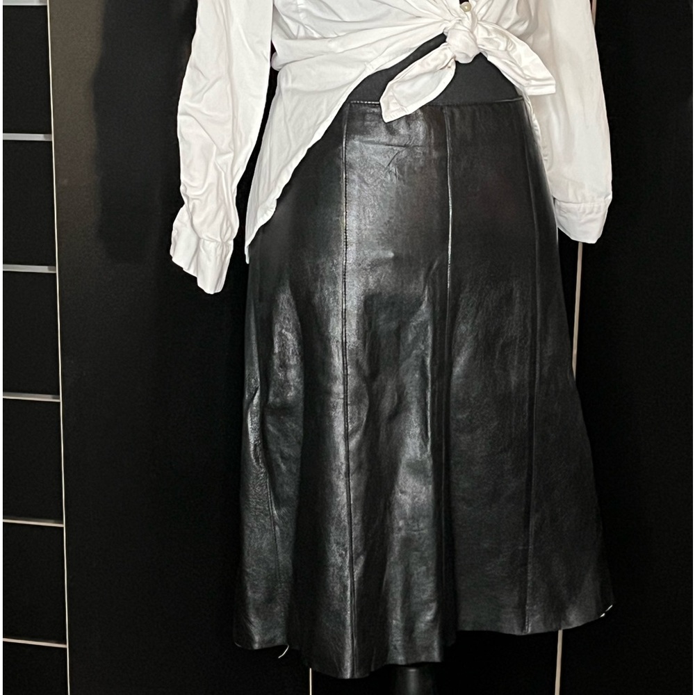 Bebe black leather pleated skirt with satin slip.